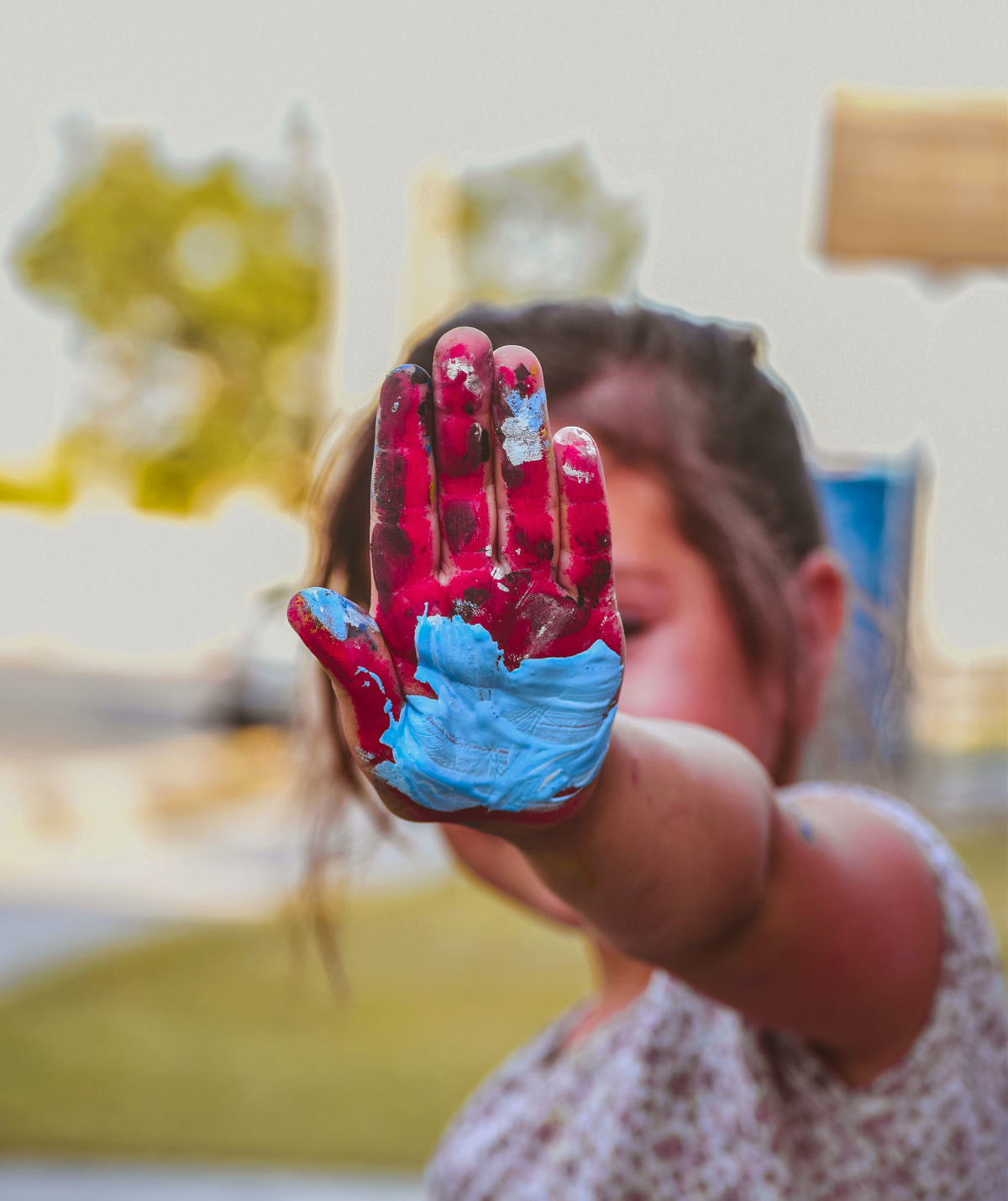 Marie painting her stone at home